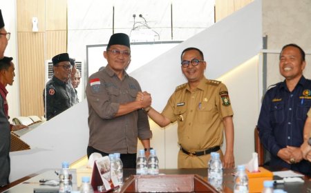 Pj. Bupati Kampar Tandatangani NPHD Bersama KPU dan Bawaslu