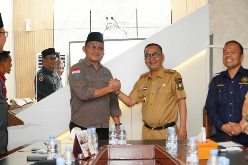 Pj. Bupati Kampar Tandatangani NPHD Bersama KPU dan Bawaslu